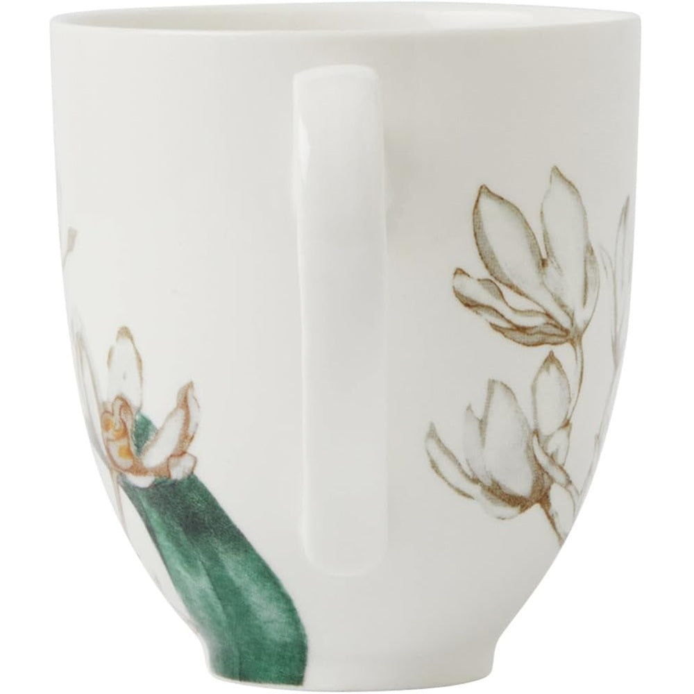 White mug with floral design on a white background