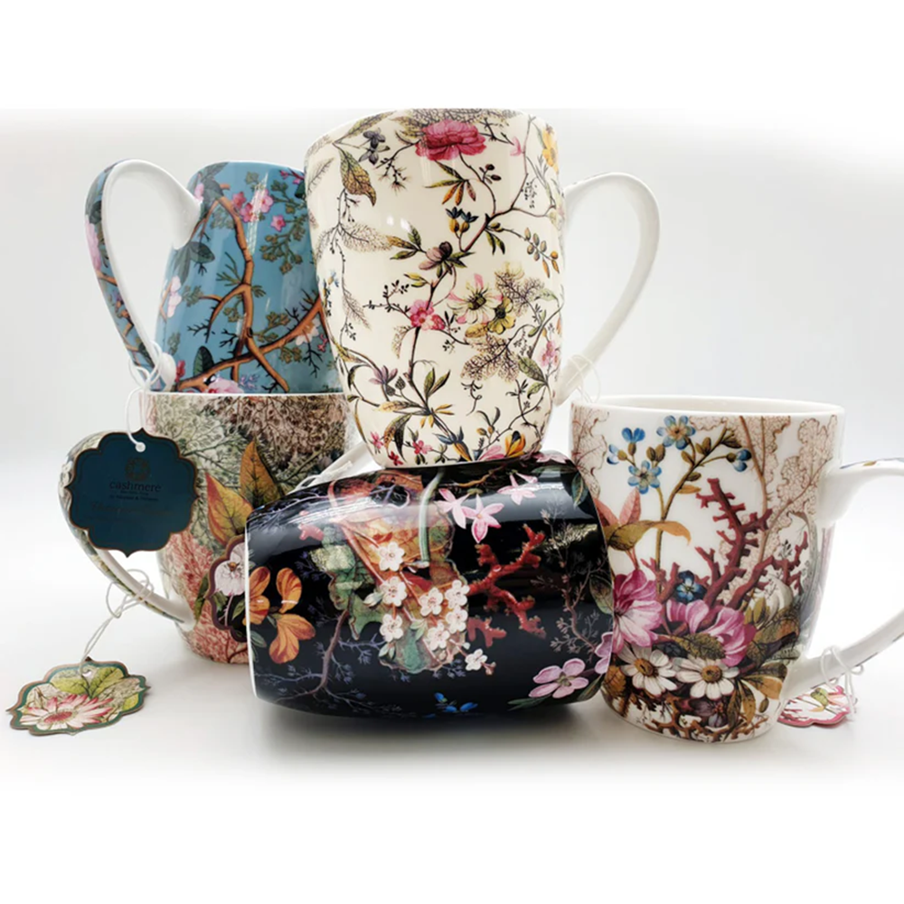 Set of floral-patterned mugs on a white background
