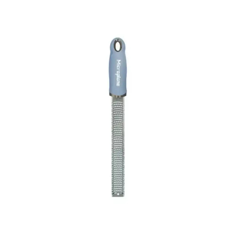 Microplane zester with blue handle on a white background