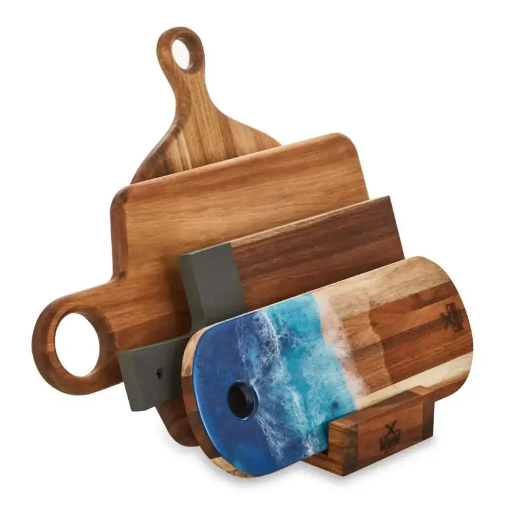 Set of wooden cutting boards with a blue resin design on a white background