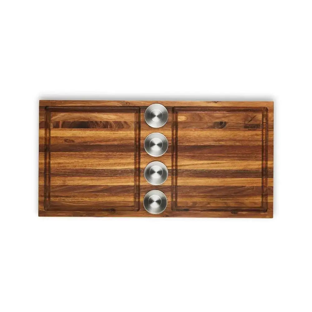 Wooden cutting board with three silver knobs on a white background