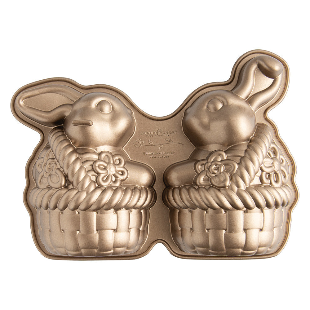 Gold bunny-shaped cake pan with 'Ninety-Eight' branding on a white background