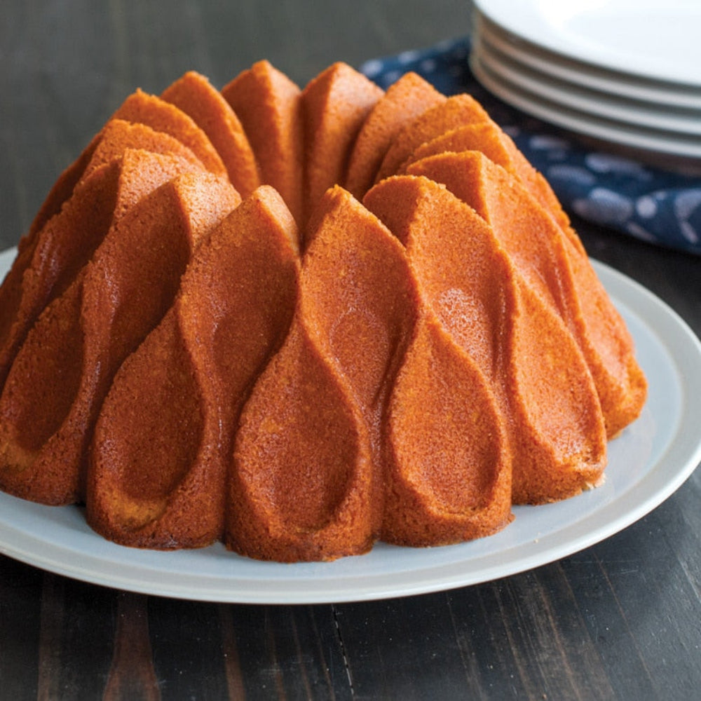 Bundt cake on a white plate with a dark background