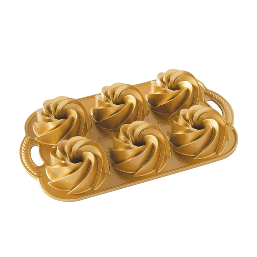 Gold mini bundtlette pan on a white background