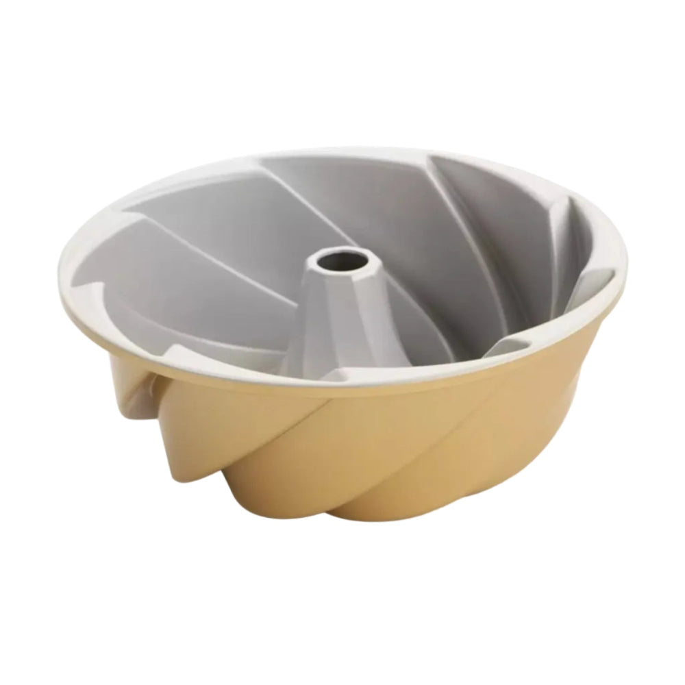 Bundt cake pan with beige outer and gray interior on a white background