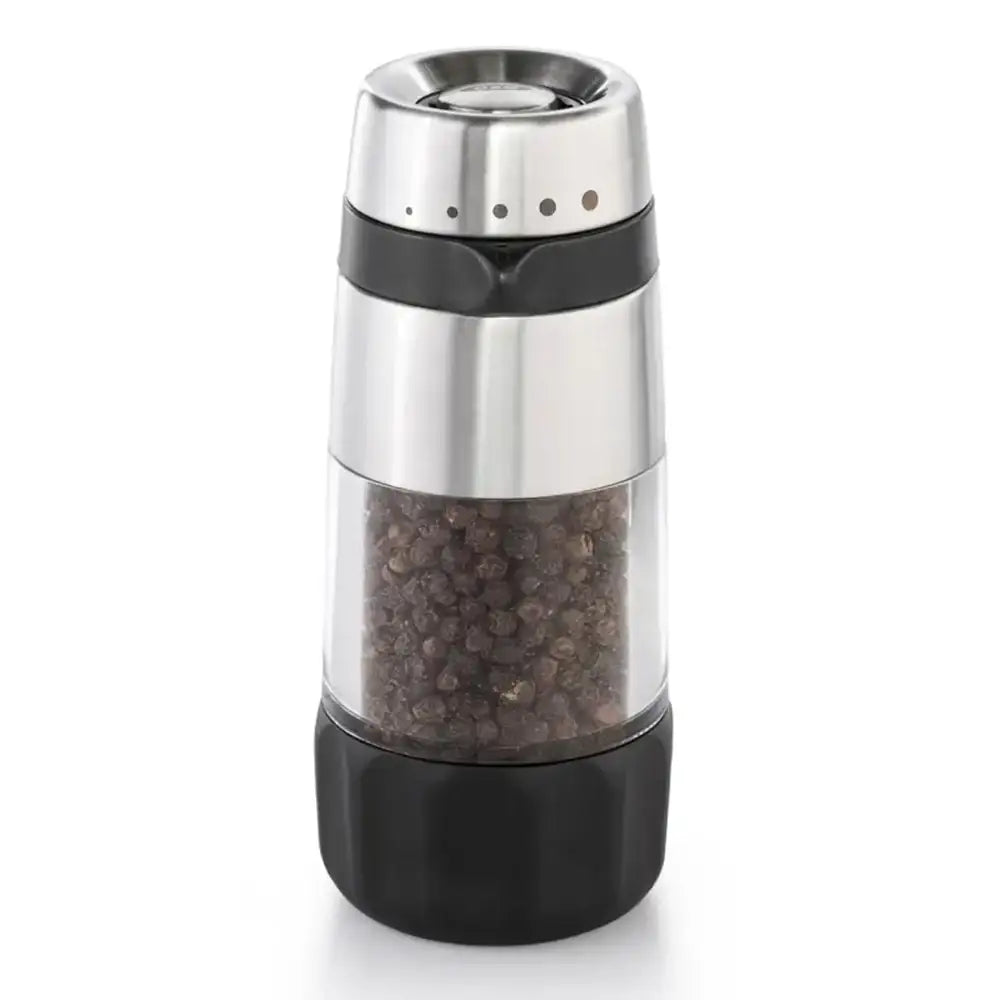 Pepper grinder with black pepper inside on a white background