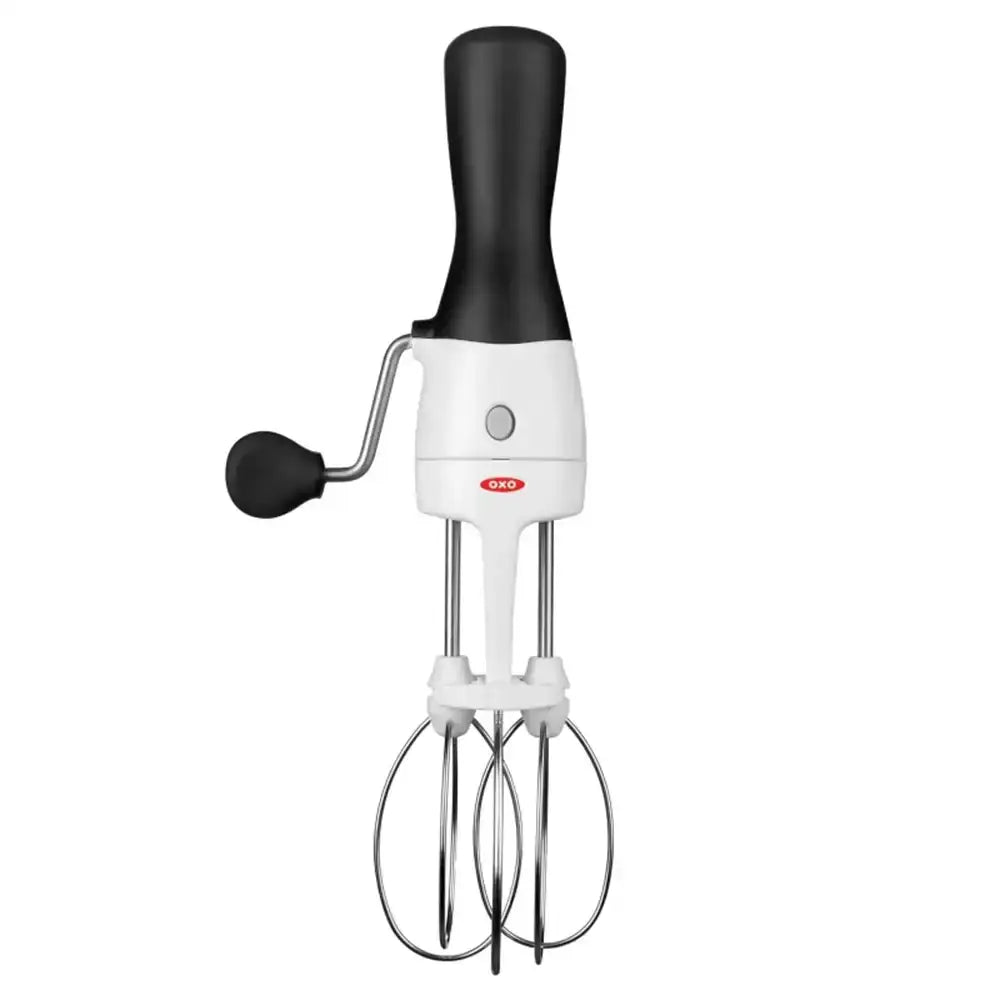 Hand mixer with black handle and white body on a white background