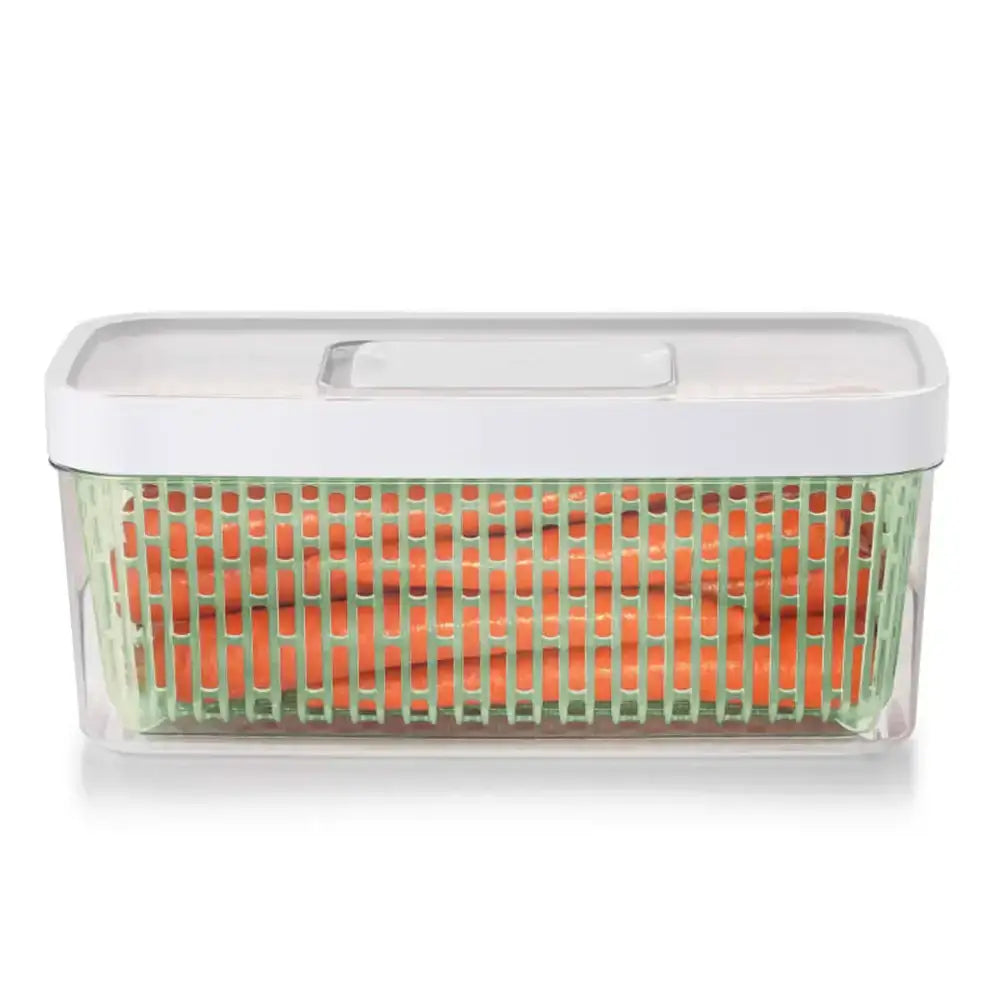 Clear container with orange items inside on a white background