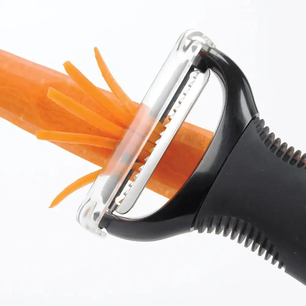 Y-shaped peeler with a carrot being peeled on a white background