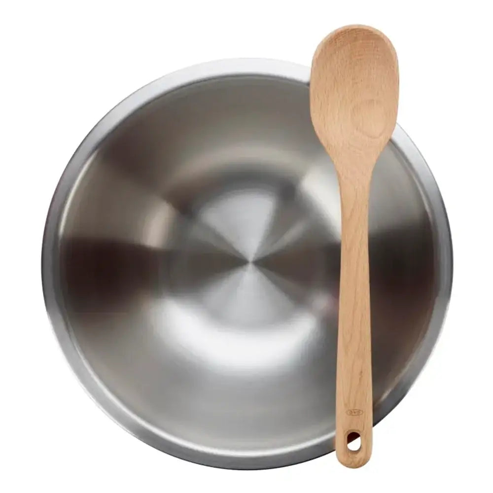 Stainless steel bowl with a wooden spoon on a white background
