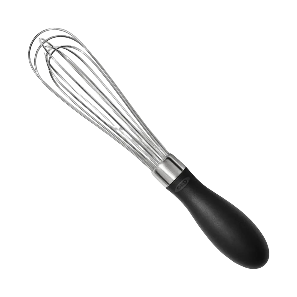 Metal whisk with black handle on a white background