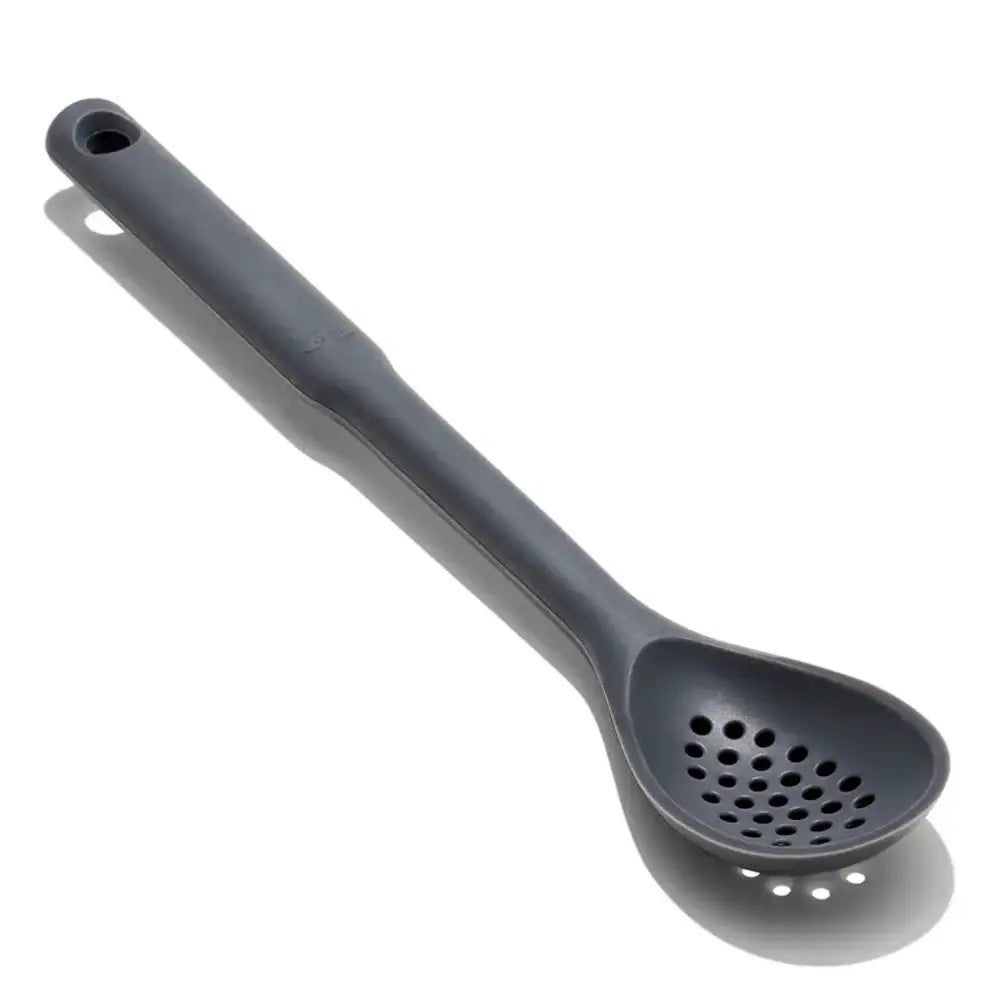 Gray kitchen ladle with perforated spoon on a white background