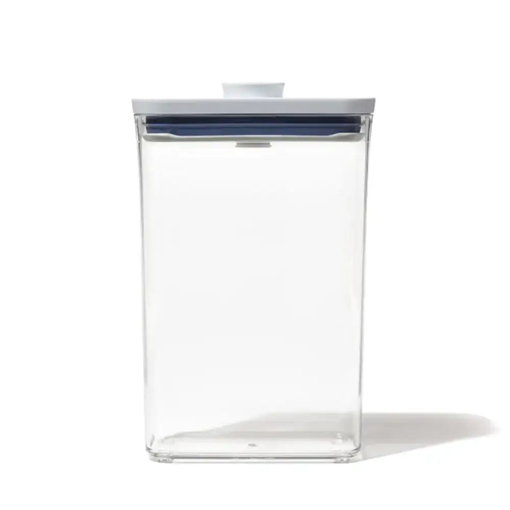 Clear plastic container with a blue lid on a white background