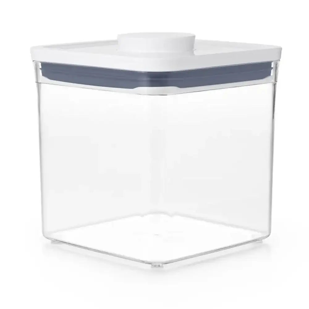 Clear storage container with a white lid and blue rim on a white background
