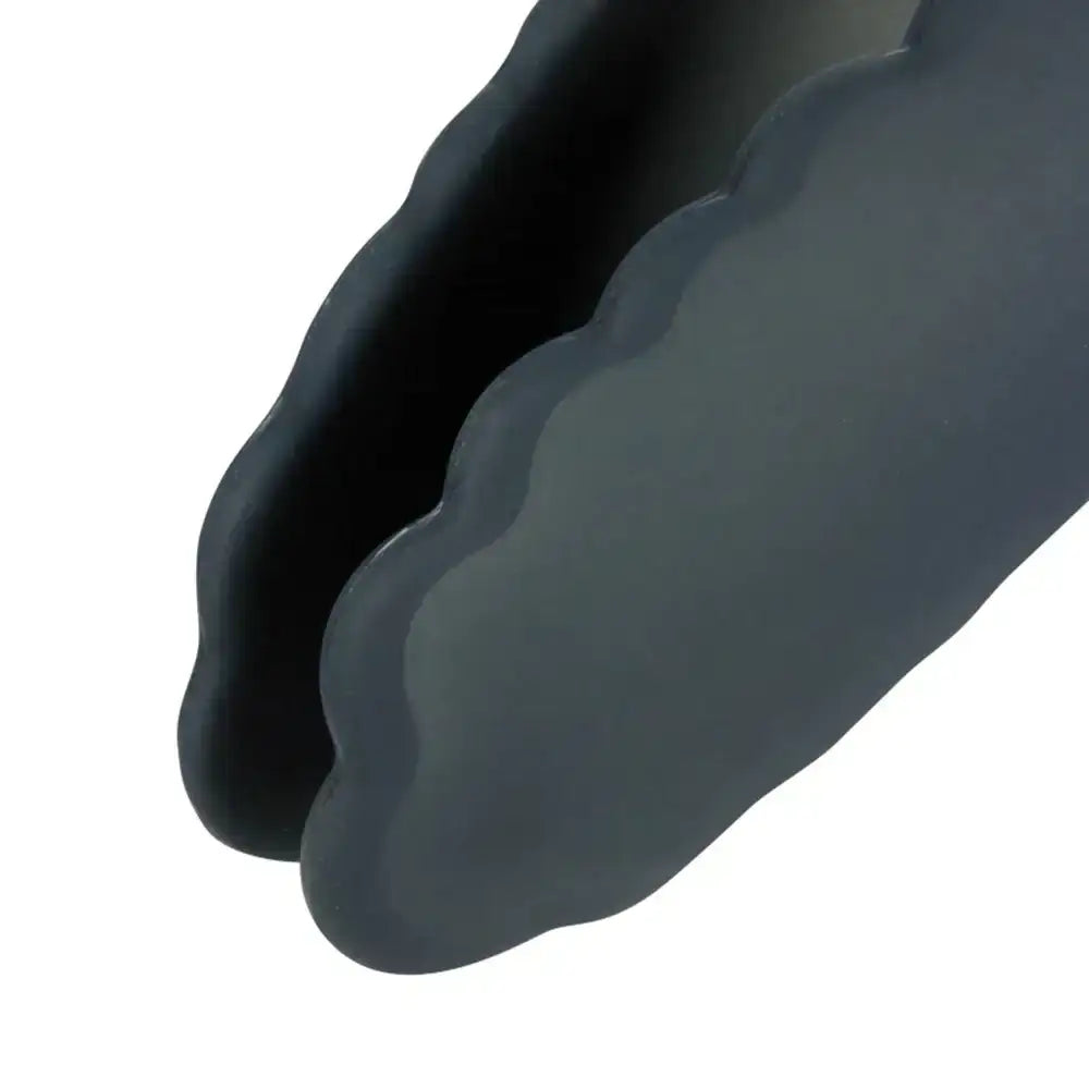 Close-up of a dark gray wavy object on a white background