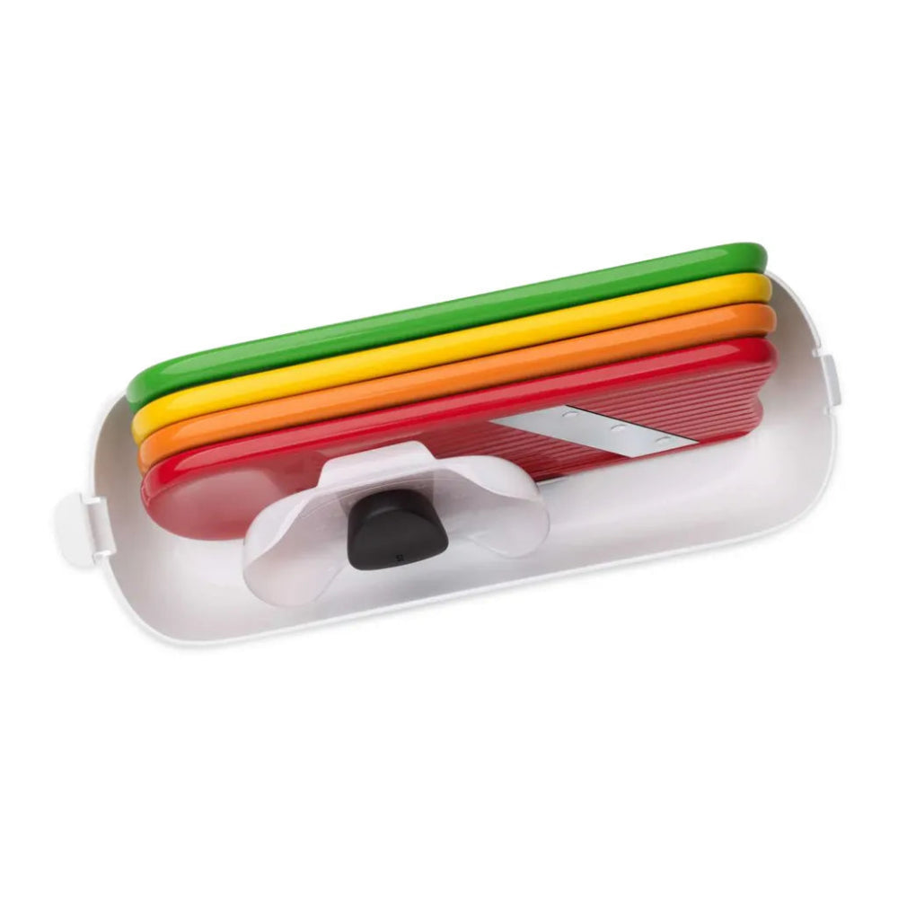Set of colorful slicing boards in a white holder on a white background