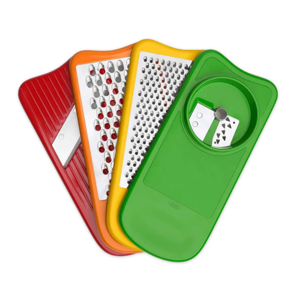 Four colorful grating boards with different designs on a white background