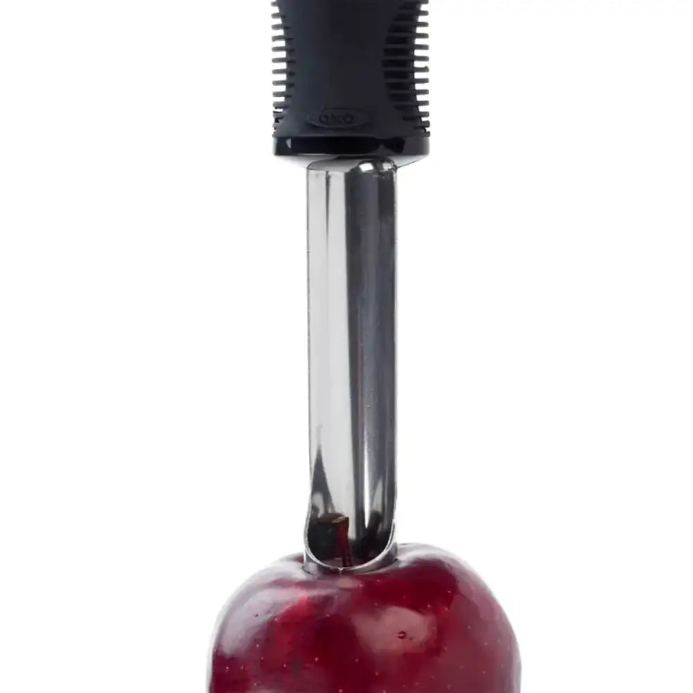 Apple corer with a red apple on a white background