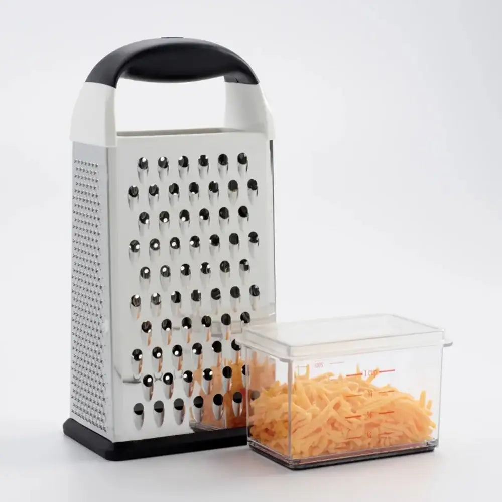 Box grater with a container of shredded cheese on a white background