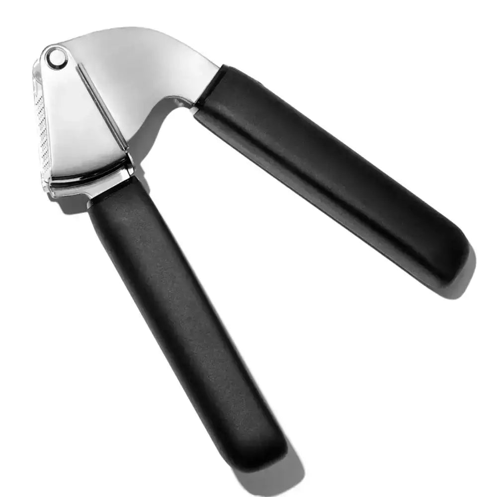 Garlic press with black handle and silver top on a white background