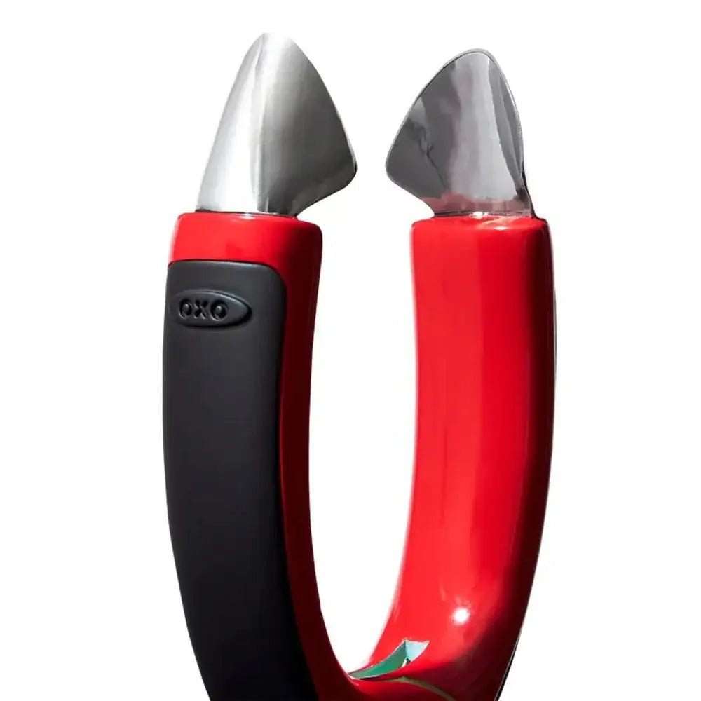 Red and black kitchen tool on a white background