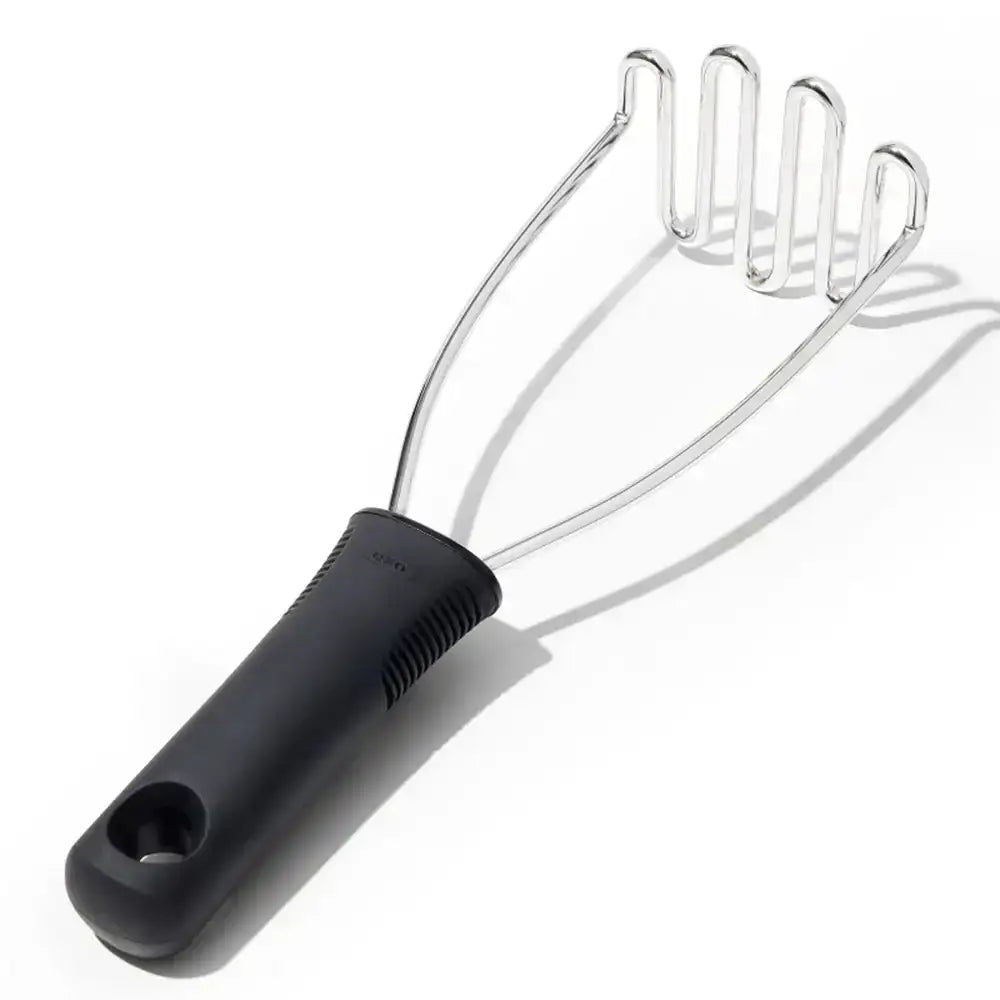 Masher with black handle on a white background