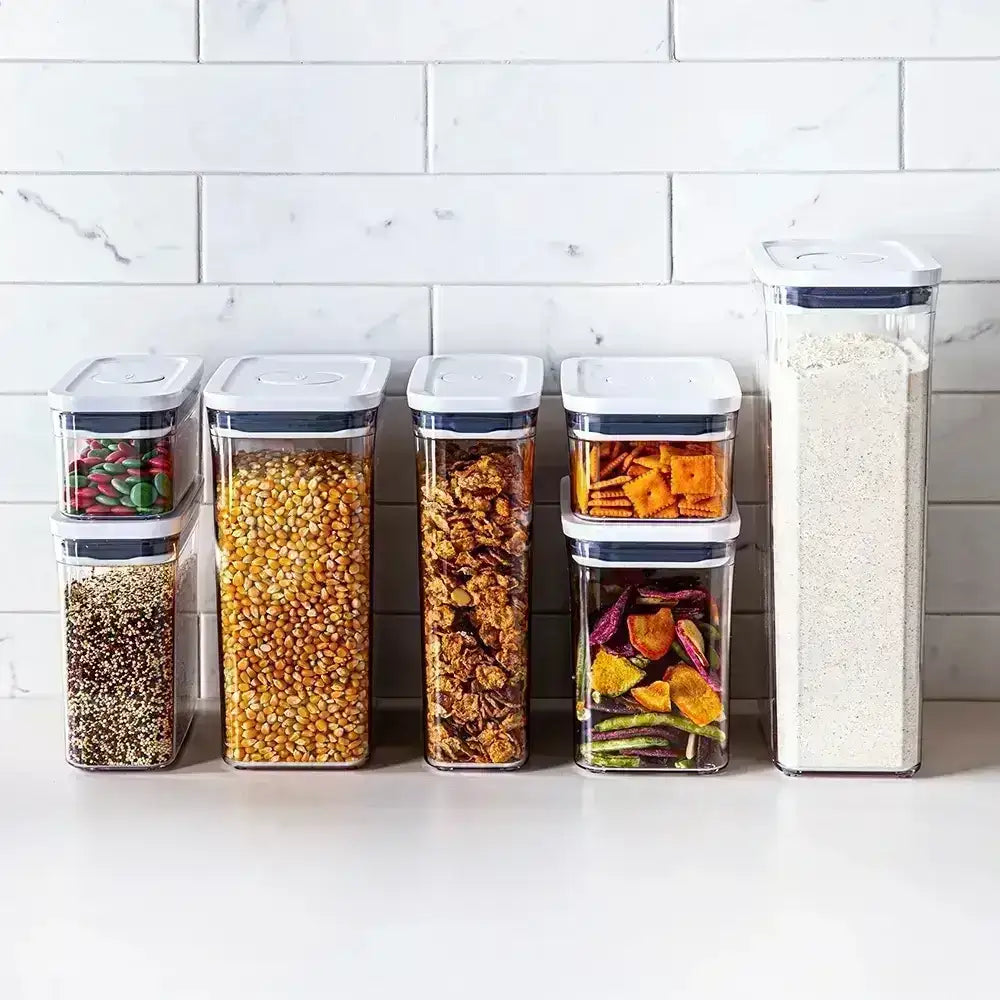 Set of storage containers with lids on a kitchen counter