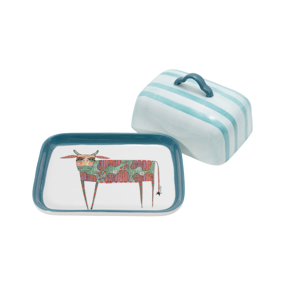 Rectangular dish with cow design and striped container on a white background