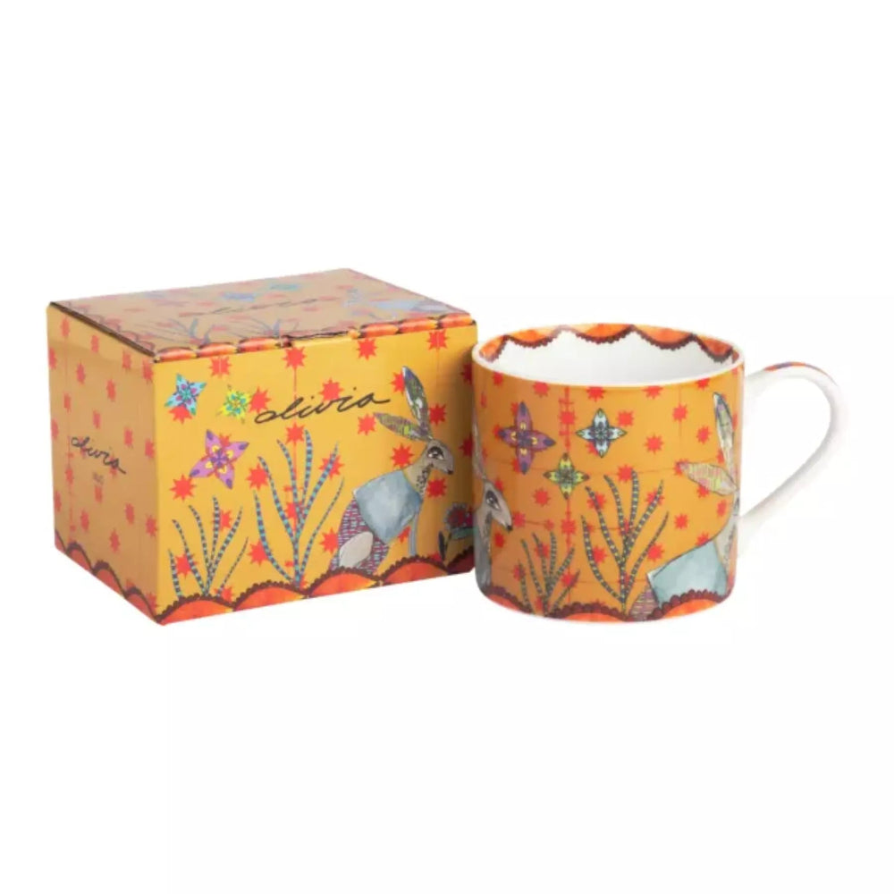 Colorful mug with animal design and matching box on a white background