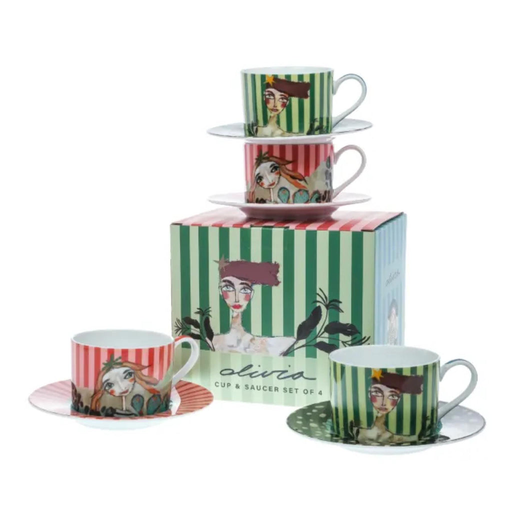 Set of four cups and saucers with artistic designs on a white background