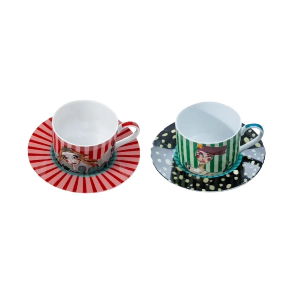 Two ceramic cups with saucers on a white background