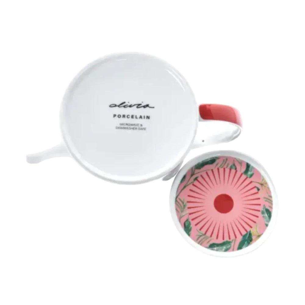 Teapot with floral design on lid and white lid featuring brand name.