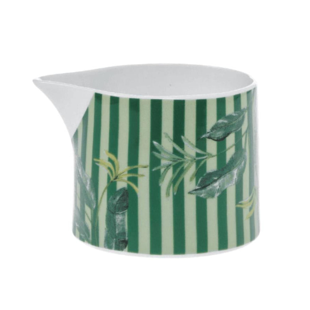 Green and white striped creamer with leaf design on a white background