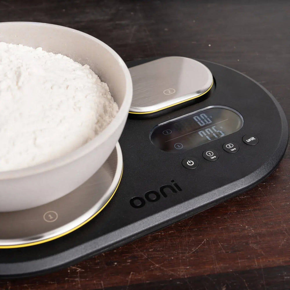 Close up of a digital scale with a bowl of flour 