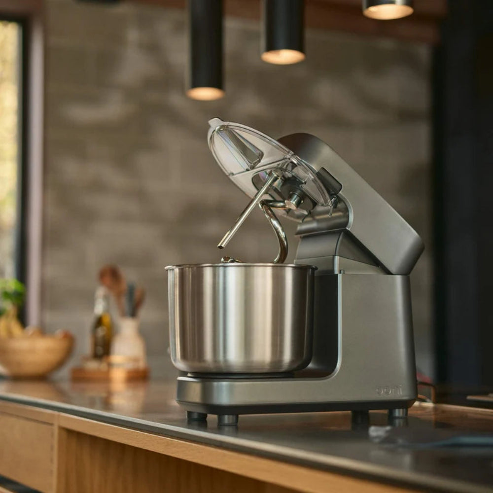 Dark grey and silver mixer on a kitchen counter