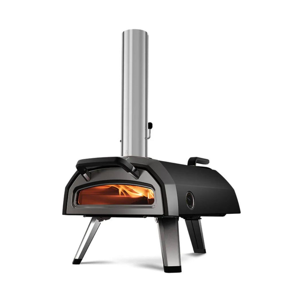 Portable outdoor pizza oven with fire visible inside on a white background