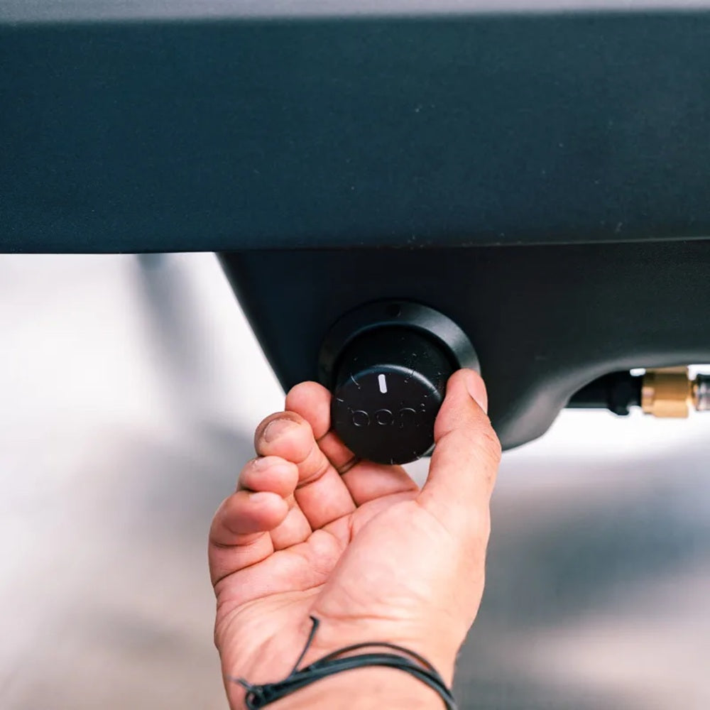 Hand inserting a key into a car ignition