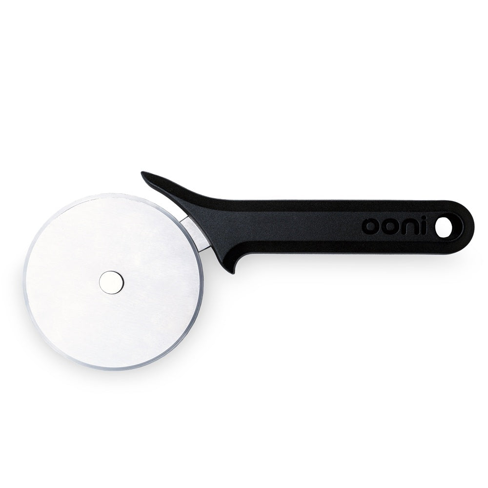 Black pizza cutter with a white wheel on a white background