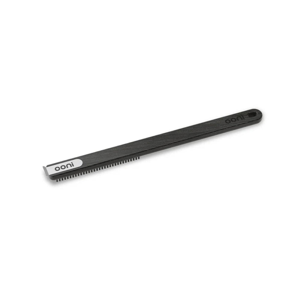 Ooni pizza oven cleaning brush with a white background 