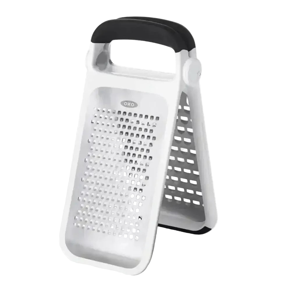 White box grater with black handle on a white background
