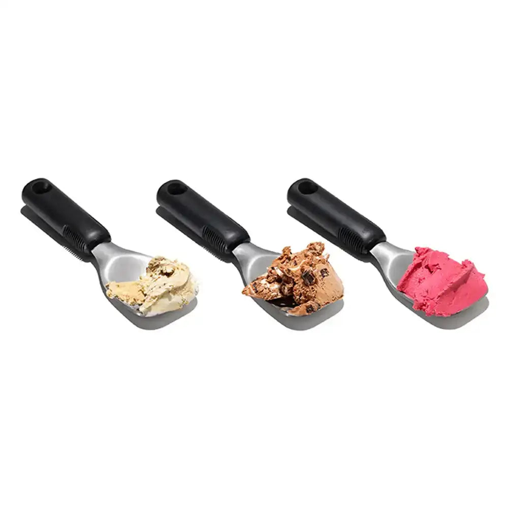 Three ice cream scoops with different flavors on a white background