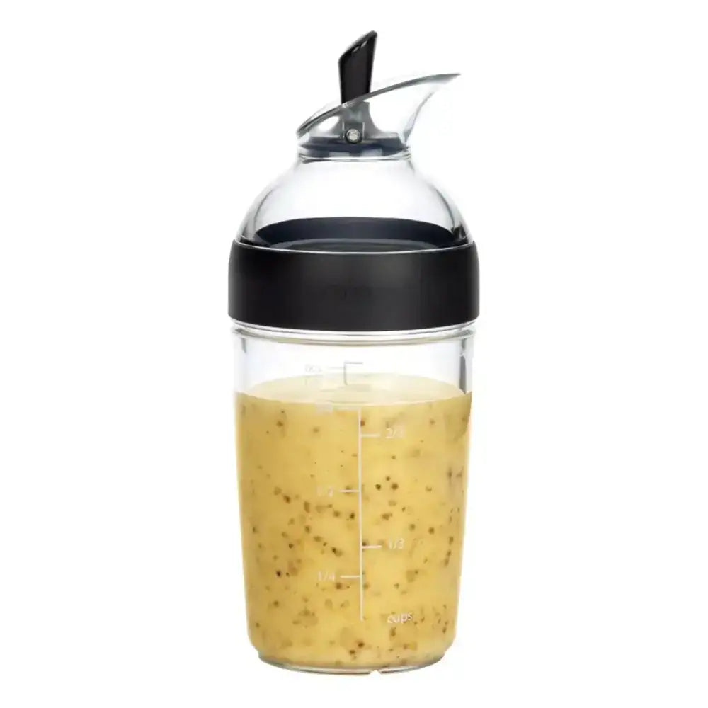 Clear bottle with black cap containing a yellowish liquid on a white background