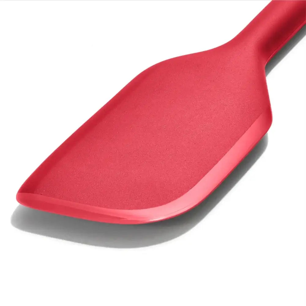 Red spatula on a white background