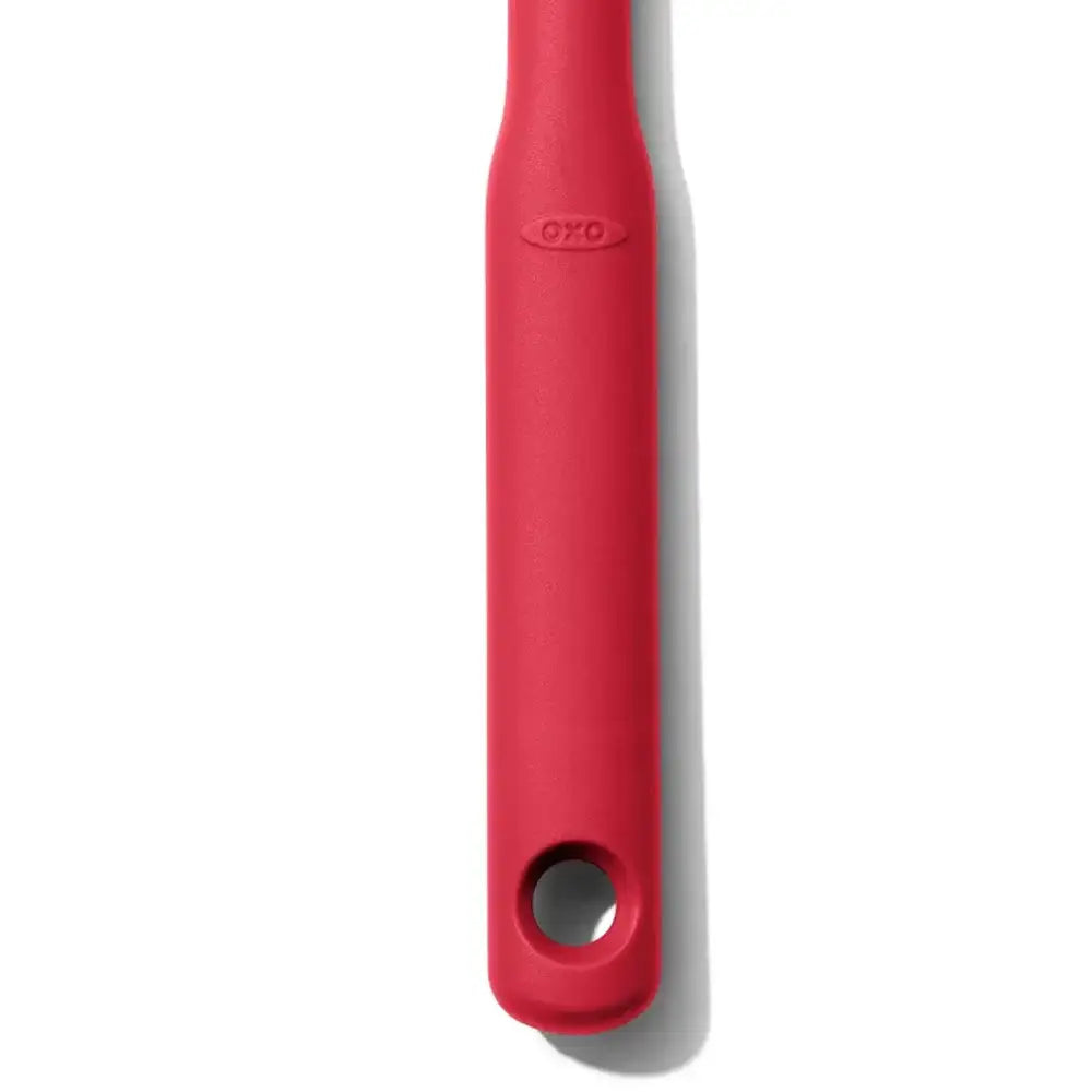 Red OXO tool on a white background