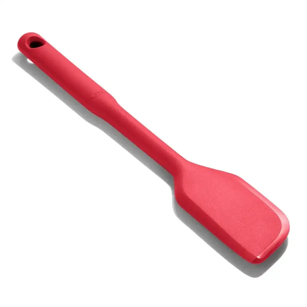 Red spatula on a white background