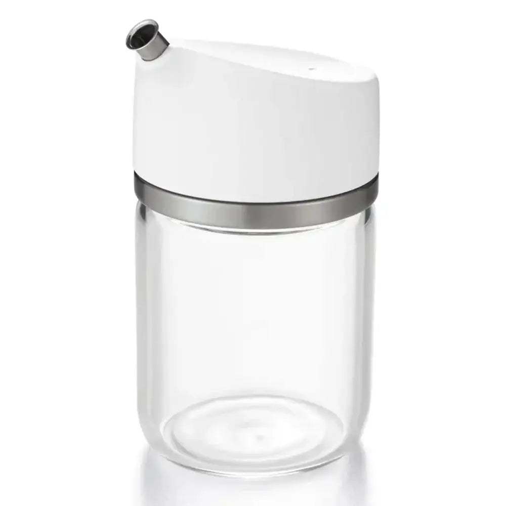 Clear glass container with a white lid and silver band on a white background