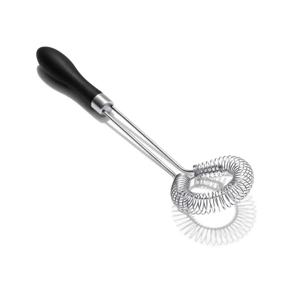 Metallic whisk with black handle on a white background
