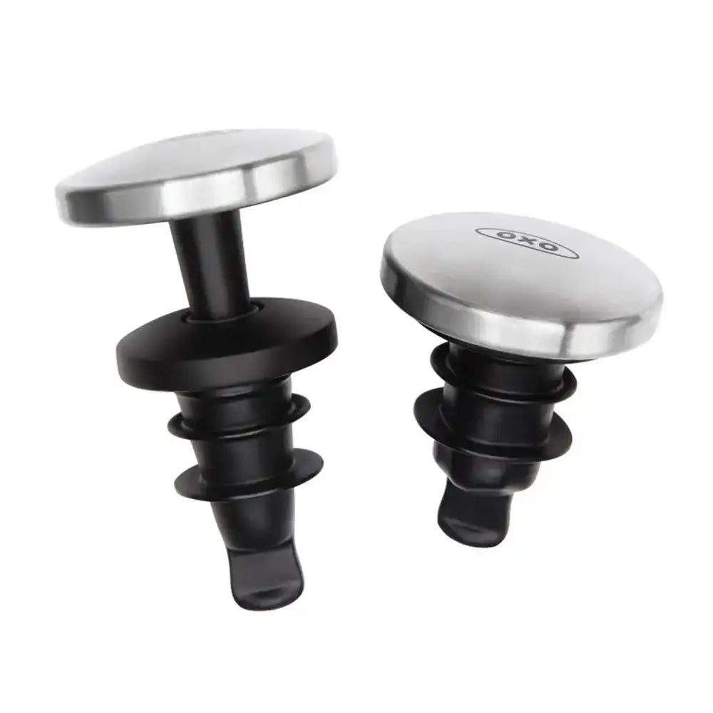 Two bottle stoppers with black and silver designs on a white background