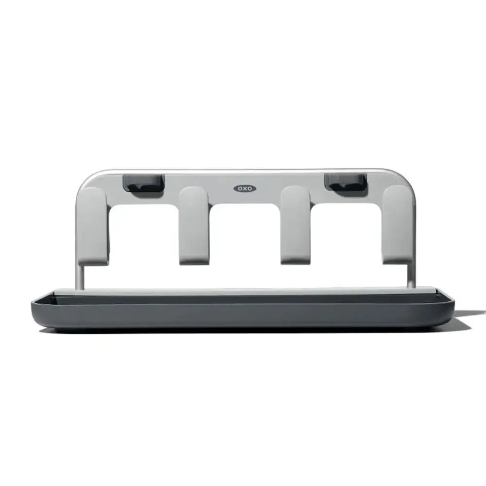 Gray kitchen utensil holder with three vertical holders on a white background