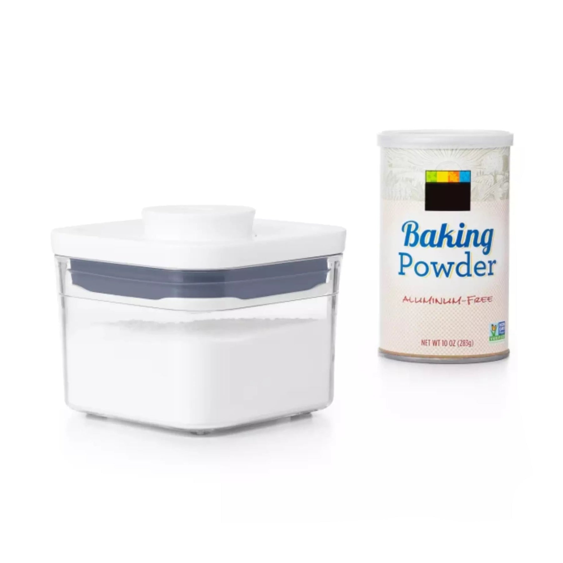 Baking powder container and a clear storage container on a white background